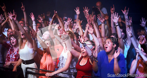 Image of Music, fans and people dance at concert, event and lights from stage for performance at festival. Nightclub, party and audience celebration or excited crowd listening to dj and techno with freedom