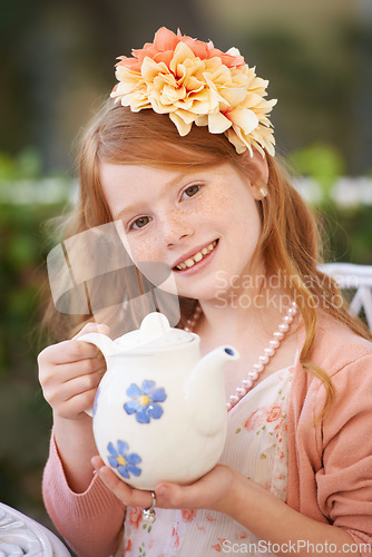 Image of Girl, child and tea or happy in garden with party for birthday, celebration and playing outdoor in home. Person, portrait and face in backyard of house with dress up, beverage and role play fun