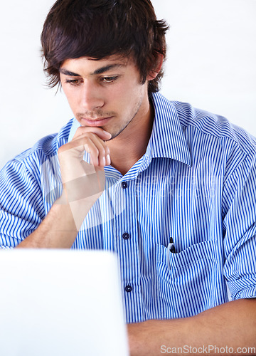 Image of Man, working and thinking with laptop, face and studio background for company, employee and digital. Agency, internet and online for email, young or technology with news, job or reading for business
