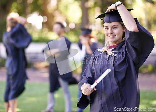 Image of Happy woman, portrait and student with degree in graduation for education, learning or qualification. Female person or graduate smile for higher certificate, diploma or award at outdoor ceremony