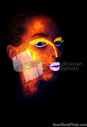 Image of Portrait, beauty and creative with neon woman on black background for makeup, glitter or colorful glow. Face, fantasy and art with confident young person in the dark for psychedelic or techno paint