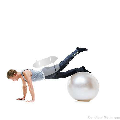 Image of Yoga ball, fitness and man in a studio with a body, health and wellness exercise for balance. Sports, equipment and young male athlete with stretching workout or training isolated by white background