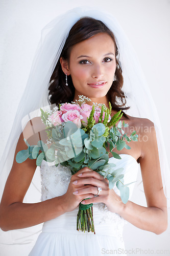 Image of Woman, portrait and flower bouquet or wedding dress for bride event, love promise or diamond ring. Female person, plant and marriage or floral romance or partnership for commitment, elegant or party