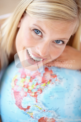 Image of Excited woman, travel and globe with portrait and happy from earth day, holiday or international vacation. Smile, world and map for learning and geography with a female person and embrace of planet