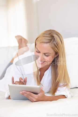 Image of Home, bedroom and woman with a tablet, typing and communication with internet, social media and relax. Person, apartment and girl with technology, connection and digital app with a smile and network