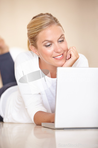 Image of Home, thinking and woman on the floor, laptop and communication with internet, social media and typing. Person, apartment and girl with technology, connection and digital with network and relax