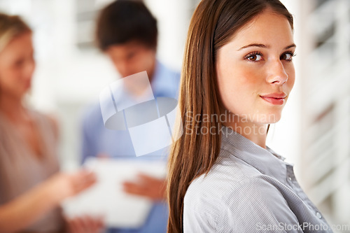 Image of Portrait, mindset and internship with a business woman in her office on a blurred background for career. Face, happy and confident with a young employee closeup in the workplace of a design agency