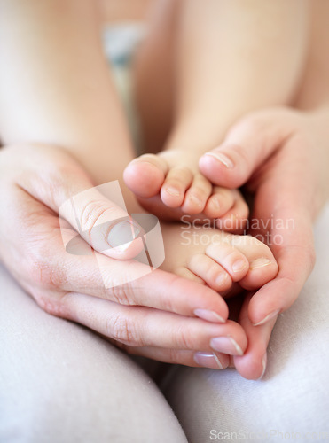 Image of Love, person and hands with newborn or feet for development, nurture and bonding in nursery of apartment. Family, parent and baby toes with trust, support or care for relationship or closeup in home