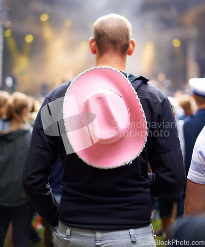 Image of Man, crowd and music festival event audience or cowboy hat, rave outfit at party concert. Male person, back view and dj dancing night a social vacation for holiday relax experience, band to celebrate