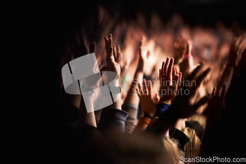 Image of Hands, crowd or audience or music festival at night for a party or event of celebration together. Concert, disco or dance with a group of people outdoor at a carnival for performance or entertainment