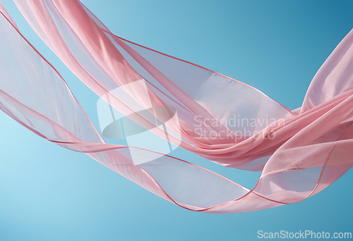 Image of Flying pink fabric wave on blue background, flowing waving silk 