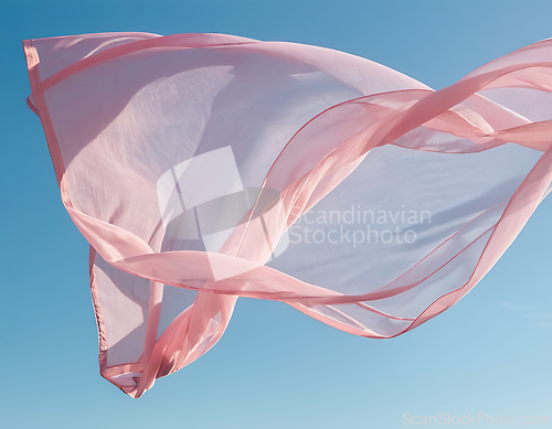 Image of Flying pink fabric wave on blue sky background and illuminated b