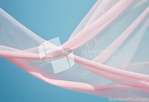 Image of Flying pink transparent fabric wave on blue background and illum