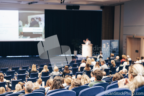 Image of Speaker giving a talk on scientific conference. Audience at the conference hall. Business and Entrepreneurship concept.