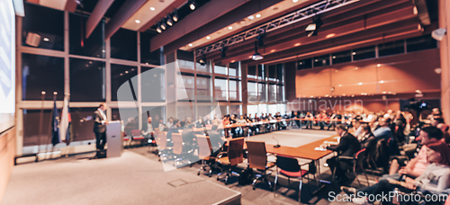 Image of Public speaker giving talk at Business Event.