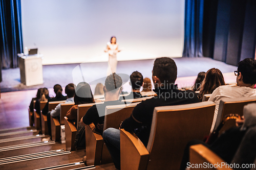 Image of Woman giving presentation on business conference event.