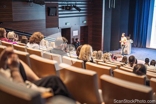 Image of Woman giving presentation on business conference event.