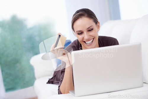 Image of Woman, laptop and credit card on sofa for online shopping, fintech payment and upgrade membership account at home. Happy lady, computer and password for banking, ecommerce sales and financial savings