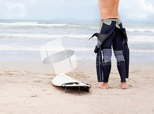 Image of Beach, body or ready to start surfing with surfboard on vacation or adventure for fitness or travel. Back view of athlete, swimwear or man at seaside on holiday in Hawaii or ocean in extreme sports