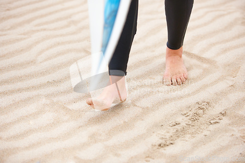 Image of Surfer, walking or feet on beach sand with surfboard on vacation for fitness training, wellness or travel. Legs of athlete, person or surfing at sea on holiday in Hawaii or ocean in extreme sports