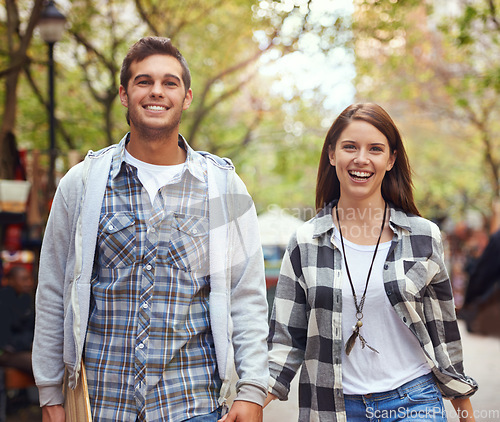 Image of Portrait, walking and happy couple holding hands on city journey, morning trip and tour of urban Paris for outdoor adventure. Love, travel and bonding man, woman or people together on relax commute