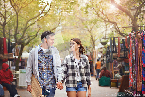 Image of Happy, walking and couple holding hands on city journey, morning trip or skateboarding tour of urban Paris for outdoor adventure. Love, eye contact and young people bonding together on relax commute