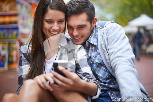 Image of City, smile and couple with a smartphone internet and social media with texting, message and meme. New York, man or woman with a cellphone, mobile user and digital app with network, joy or happiness