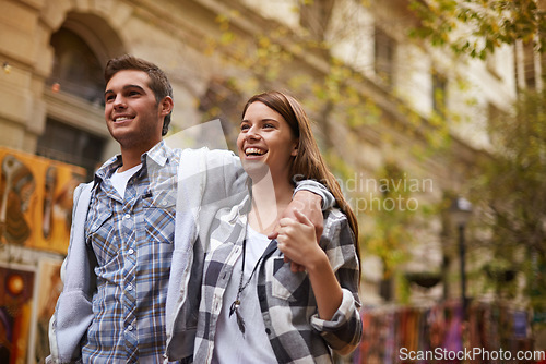 Image of Happy, walk and urban couple hug, smile and bonding on relax journey, morning trip or weekend date. Relationship trust, security and romantic people commute for public tour, fresh air or wellness