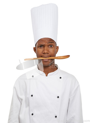 Image of Portrait, chef and black man with spoon in mouth isolated on white studio background. Person, kitchen utensil and serious face of cooking professional, baker or restaurant worker in catering service