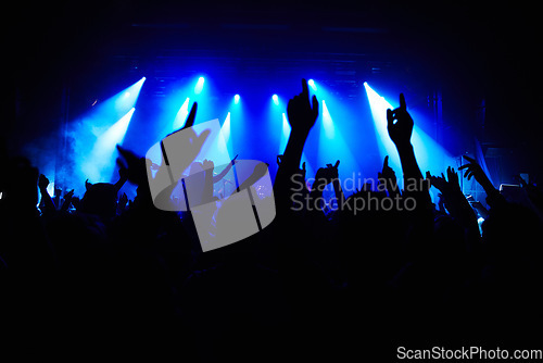 Image of Club, music and audience with hands and lights for party, concert or rave festival with spotlight and dancing. Disco, psychedelic event and performance with entertainment, crowd and mock up space