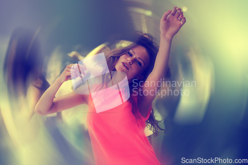 Image of Club, portrait and woman on dance floor with energy, blur or freedom, music or celebration. Party, concert or lady person in crowd with movement, motion and good vibes at festival, event or nightclub