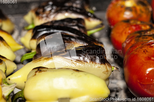 Image of cooking natural organic peppers and tomatoes