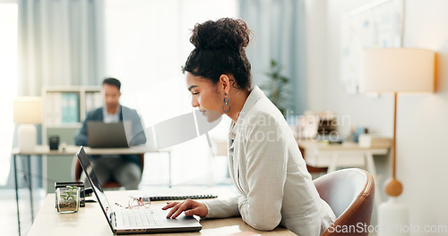 Image of Woman with desk, laptop and typing in coworking space, market research and online schedule at consulting agency. Office, admin business and girl at computer writing email review, feedback or report.