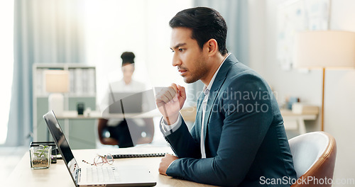 Image of Man at desk, laptop and thinking in coworking space, market research or online schedule at consulting agency. Office, idea and businessman at computer writing email article review, feedback or report