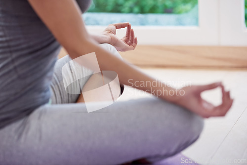 Image of Person, hands and home meditation for peace, calm and mental health in yoga, wellness and mindfulness. Yogi relax with lotus pose for spiritual body, chakra practice or holistic wellness in a closeup