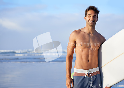 Image of Man, portrait and beach with surfboard for waves, exercise or outdoor hobby in fitness, surfing or practice. Male person or surfer with board for training at seaside or water by ocean coast in nature