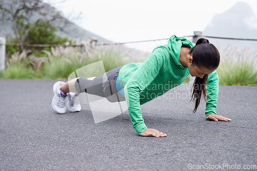 Image of Press ups, woman and outdoor with fitness, health and active for wellness and training. Fresh air, person and athlete with challenge, mountains and freedom with practice, endurance and progress