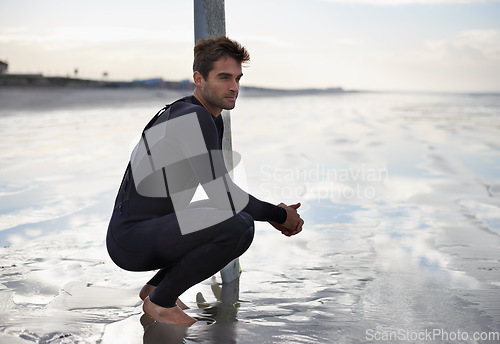 Image of Thinking, surfing and man with surfboard by ocean for waves on summer vacation, weekend and holiday by sea. Travel, nature and person by beach for water sports, adventure and hobby in Australia