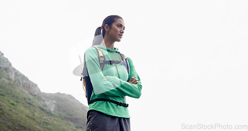 Image of Arms crossed, hiking and woman with adventure, thinking and mountains with exercise and fresh air. Person, girl or hiker with wellness, fitness or training for health and active with hobby or holiday