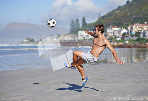 Image of Man, beach and volley with soccer ball for game, sports or exercise in outdoor hobby, training or practice. Young male person or football player kicking in match or cardio workout by ocean coast