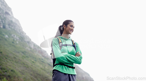 Image of Arms crossed, hiking and woman with training, thinking and mountains with adventure and fresh air. Person, girl and hiker with wellness, nature or exercise for health and active with hobby or workout