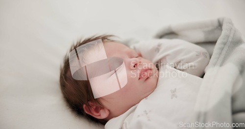 Image of Baby, sleeping and nursery room bed with morning, nap and dreaming of a young newborn at home. Cozy, sleepy kid and calm with health development from rest and peace in a house with closeup and care