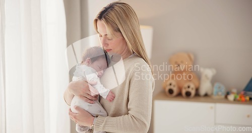 Image of Sleeping, love and mother with baby in home for bonding, relationship and child development together. Newborn, motherhood and mom carry asleep infant for care, dreaming and affection in nursery room