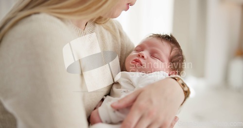 Image of Family, kiss and a mom rocking her baby to sleep in the bedroom of their home together for love or care. Dreaming, nap or tired with a mama and newborn infant in an apartment to rest for growth