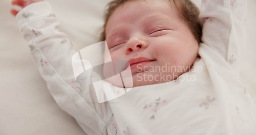 Image of Baby, sleeping stretch and nursery bed with morning, nap and dreaming of a young newborn at home. Cozy, sleepy kid and calm with health development from rest and peace in house with closeup and care