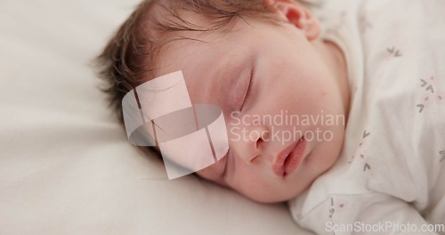 Image of Baby, sleep and nursery room bed with morning, nap and dreaming of a young newborn at home. Cozy, sleepy kid and calm with health development from rest and peace in a house with closeup and care