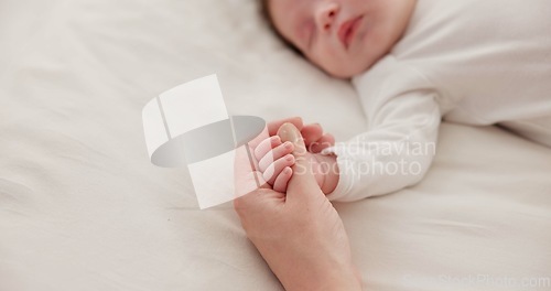 Image of Sleeping, holding hands or mother with infant, love or support for care, health or wellness at home. Fingers, family or mama with a healthy baby, protection or child development for bond or maternity