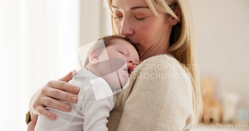 Image of Love, mother and baby in nursery for sleeping, bonding and touch or cuddle with support or care. Woman, mom or holding newborn in bedroom with bond and relax for child development and nurture in home