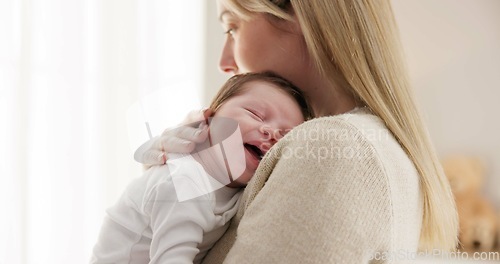 Image of Love, mother and baby in nursery for sleeping, bonding and touch or cuddle with support or care. Woman, mom or holding newborn in bedroom with bond and relax for child development and nurture in home