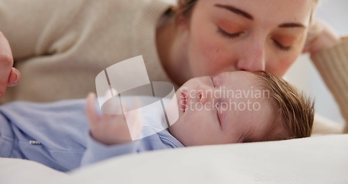 Image of Family, love and a mother on the bedroom with her baby for sleep, rest or bonding together in a home. Children, bed and a woman in an apartment with her newborn infant to relax for care or growth